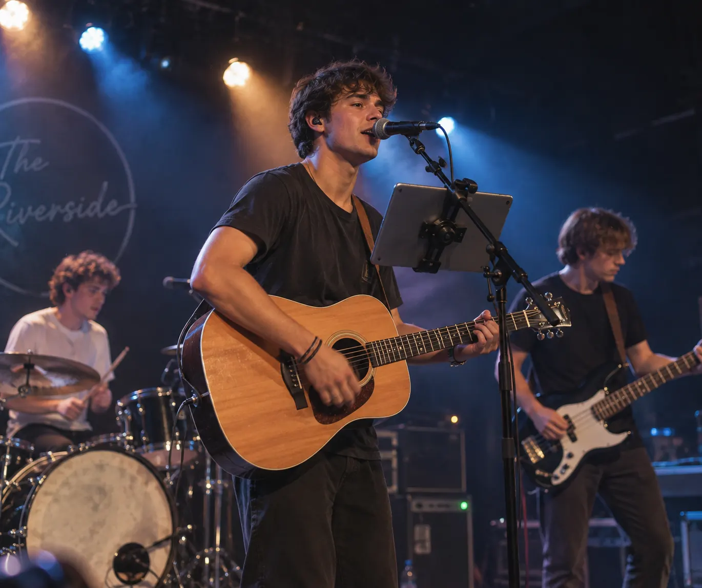 A four-piece band mid-set, the singer following a chart on a tablet clipped to the mic stand